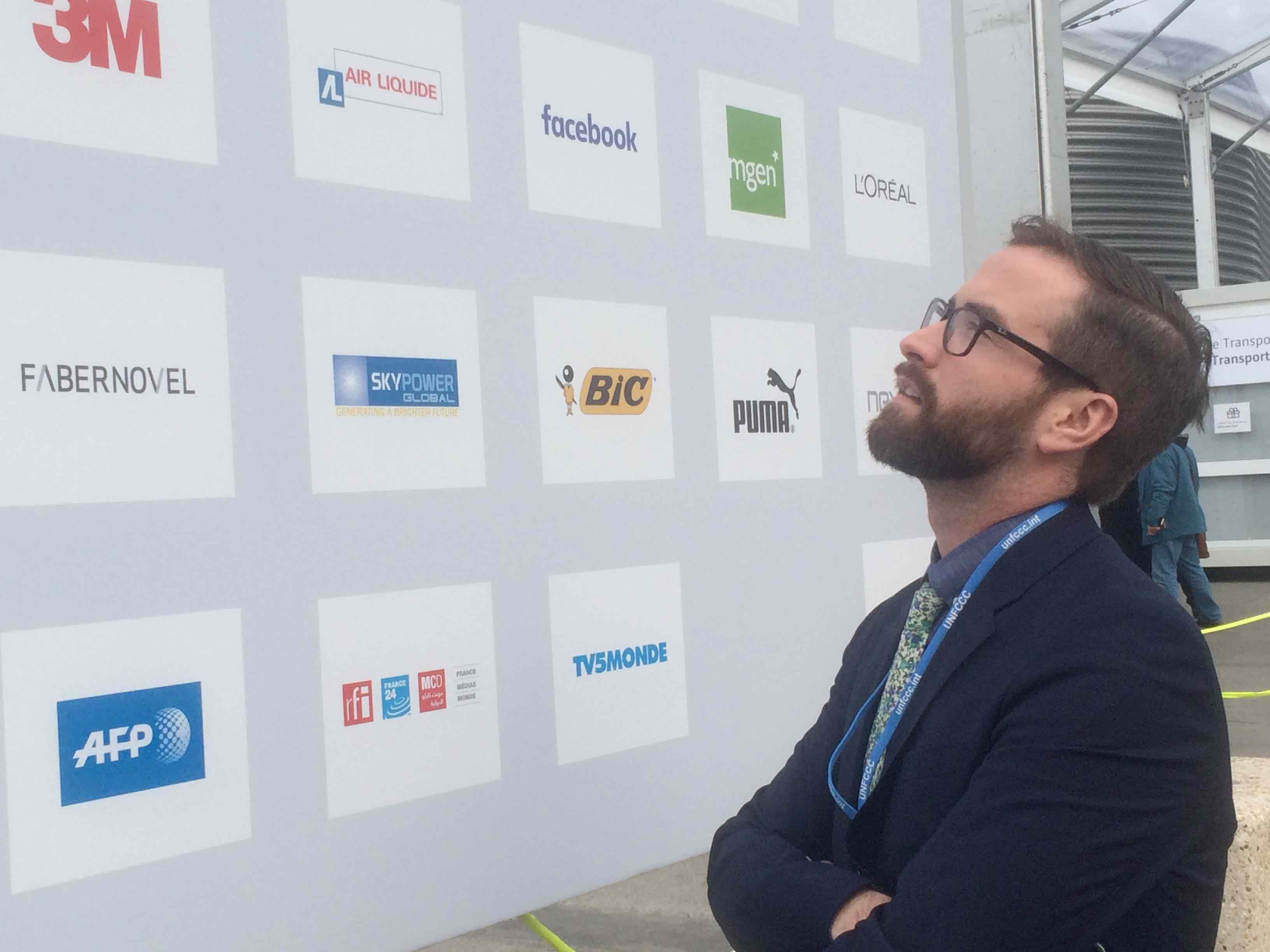 Dozens of companies picked up 20 percent of the bill for the Paris climate conference. Jesse Bragg, a spokesperson for Corporate Accountability International, says the list includes some of the world's worst polluters. Image by Daniel Grossman. France, 2015.
