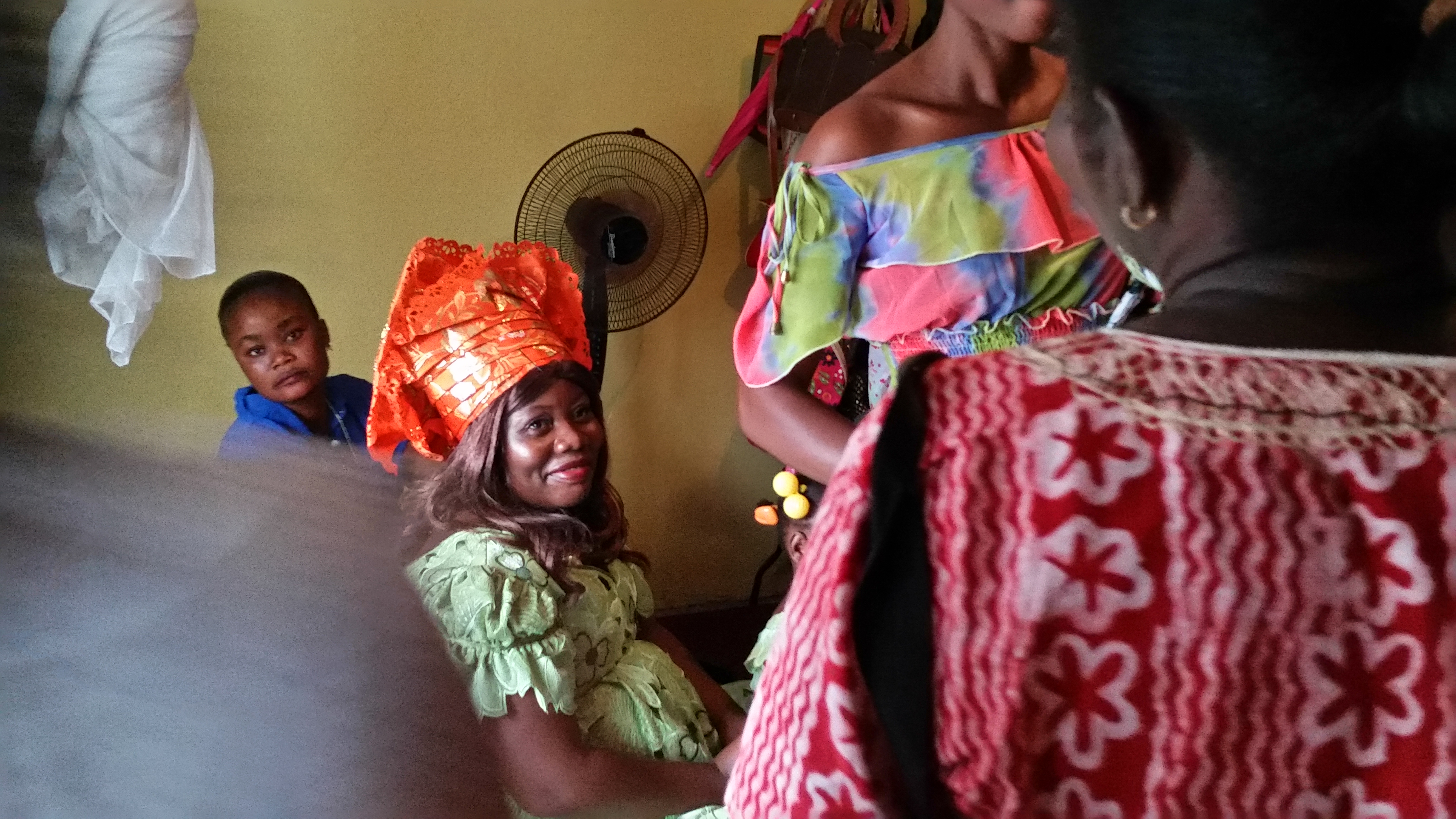 Salome Karwah, Ebola survivor and Ebola nurse, waits in her sister's bedroom on her wedding day as her aunts ask the groom's family for money, in a Liberian tradition known as Bride Price. In February 2017 she died from complications during childbirth. Image by Seema Yasmin. Liberia, 2015. Salome Karwah, Ebola survivor and Ebola nurse, waits in her sister's bedroom on her wedding day as her aunts ask the groom's family for money, in a Liberian tradition known as Bride Price. In February 2017 she died from complications during childbirth. Image by Seema Yasmin. Liberia, 2015.