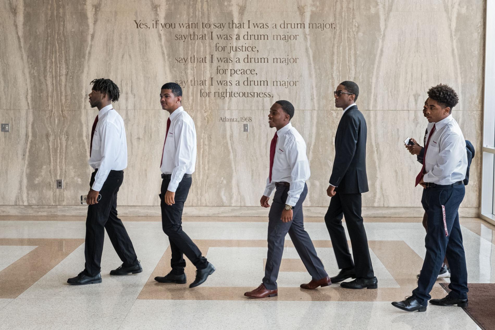 Freshmen enter the Morehouse chapel named for Martin Luther King, Jr., whose words are etched on the wall. The weekly, required Crown Forum assembly introduces leaders who address issues of the day. The all-male college aims to develop disciplined men who will lead lives of scholarship and service. Image by Radcliffe "Ruddy" Roye. United States, 2017. Freshmen enter the Morehouse chapel named for Martin Luther King, Jr., whose words are etched on the wall. The weekly, required Crown Forum assembly introduces leaders who address issues of the day. The all-male college aims to develop disciplined men who will lead lives of scholarship and service. Image by Radcliffe "Ruddy" Roye. United States, 2017.