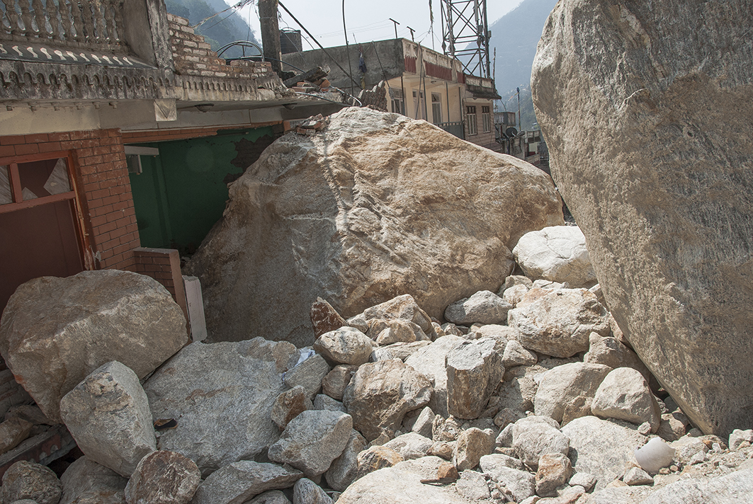 Houses in Kodari in northern Nepal survived the shaking but were crushed by gigantic rock falls. Image courtesy of Jane Qiu. Landslides devastated Kodari, Nepal.