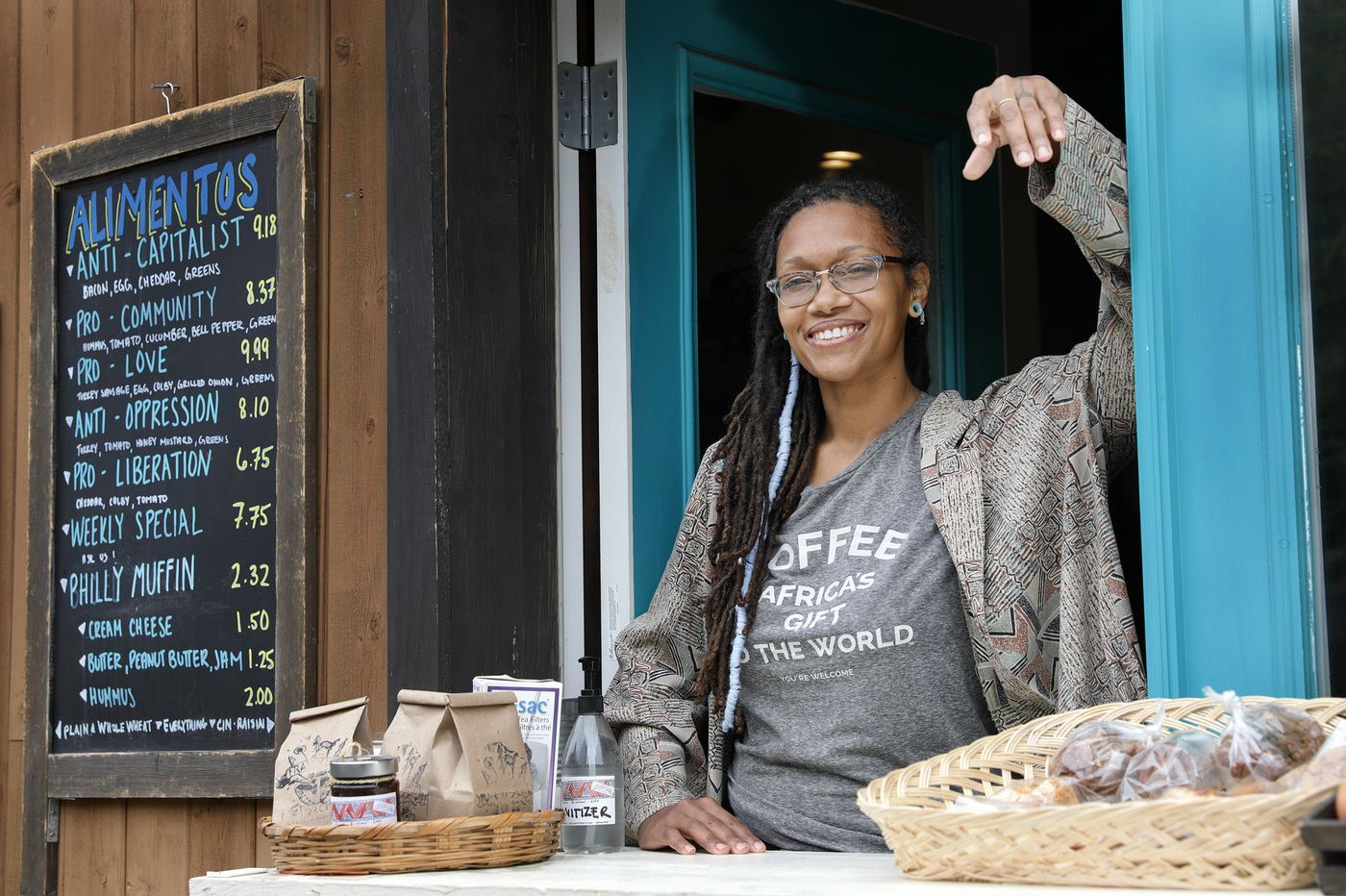 Blew Kind, owner of Franny Lou’s Porch Cafe & Community Space, 2400 Coral St., Phila. Pa., was photographed at the cafe’s take out window on May 8, 2020. Image by Elizabeth Robertson / The Philadelphia Inquirer. United States, 2020. Blew Kind, owner of Franny Lou’s Porch Cafe & Community Space, 2400 Coral St., Phila. Pa., was photographed at the cafe’s take out window on May 8, 2020. Image by Elizabeth Robertson / The Philadelphia Inquirer. United States, 2020.