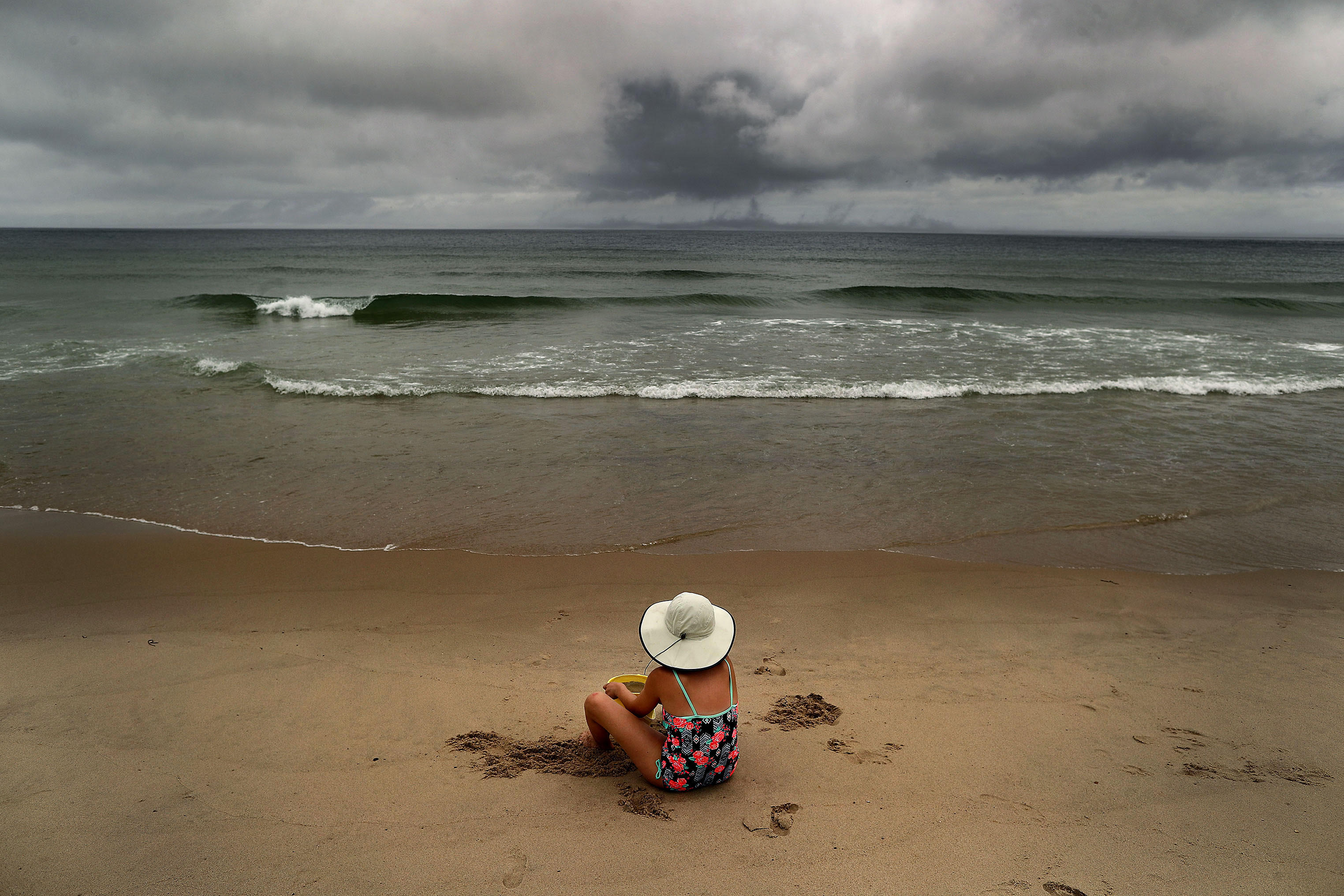 Salome Verkoville, 10 from Boston sits on Nauset Beach. Image by John Tlumacki. United States, 2019. Salome Verkoville, 10 from Boston sits on Nauset Beach. Image by John Tlumacki. United States, 2019.