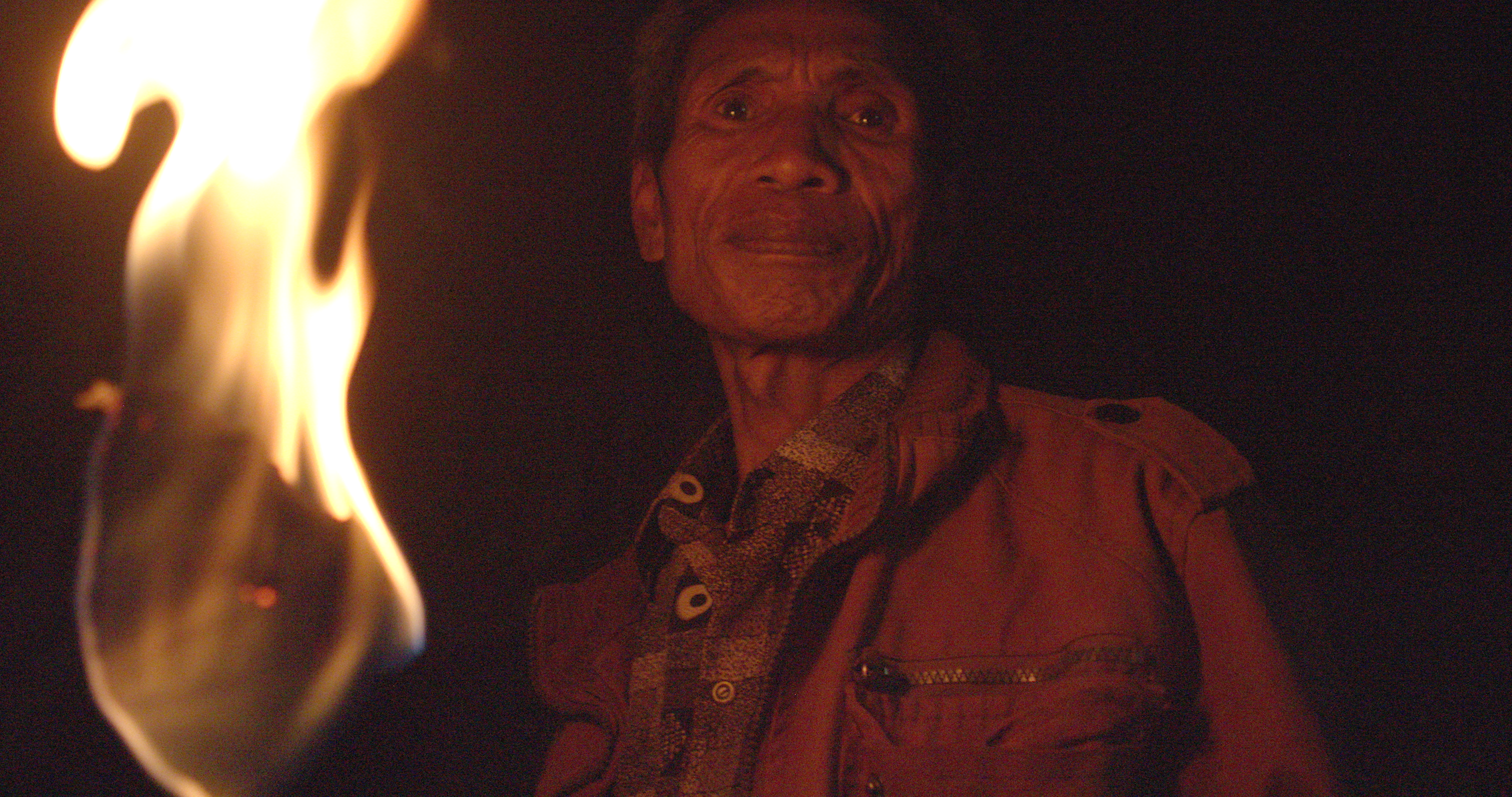 Lung Ki explores Thong Lor cave as he did when he was a child and teenager—through the light of a torch. Image by Erin McGoff. Laos, 2017. Lung Ki explores Thong Lor cave as he did when he was a child and teenager—through the light of a torch. Image by Erin McGoff. Laos, 2017.