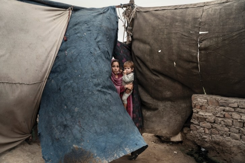Children living in an encampment, in Jalalabad, after fleeing violence between isis and the Taliban. There are now two and a half million internally displaced Afghans. Image by Adam Ferguson. Afghanistan, 2019. Children living in an encampment, in Jalalabad, after fleeing violence between isis and the Taliban. There are now two and a half million internally displaced Afghans. Image by Adam Ferguson. Afghanistan, 2019.