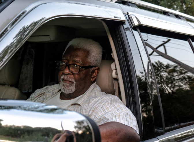 Pepper Holder sit in his SUV in front of one of the entrances to the old Koppers Tie Plant in Carbondale, Illinois on August 24, 2020. Image by Amelia Blakely. United States, 2020. Pepper Holder sit in his SUV in front of one of the entrances to the old Koppers Tie Plant in Carbondale, Illinois on August 24, 2020. Image by Amelia Blakely. United States, 2020.