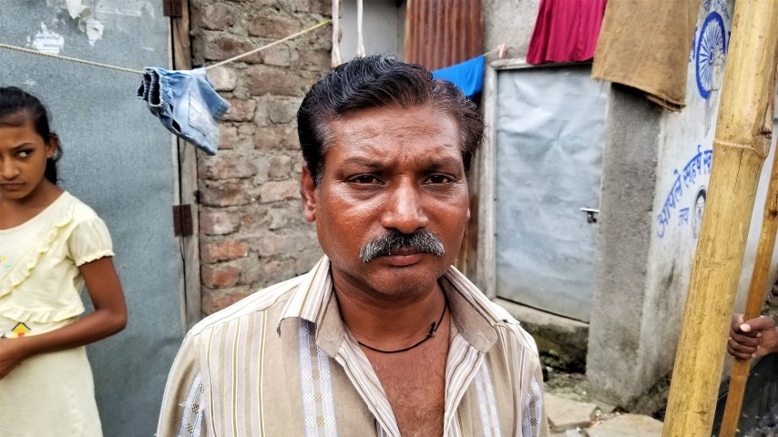 Dalit sewage cleaner, who is on the lowest rungs of so-called "untouchables." Image by Phillip Martin/WGBH News. India, 2019. Dalit sewage cleaner, who is on the lowest rungs of so-called "untouchables." Image by Phillip Martin/WGBH News. India, 2019.