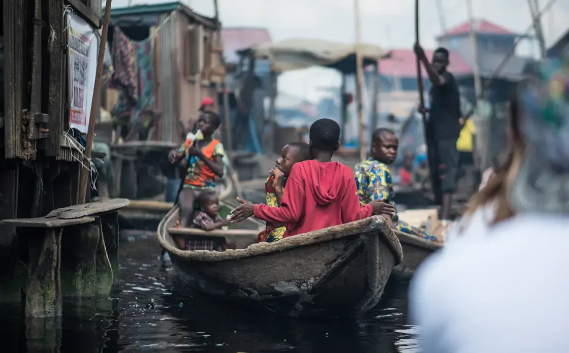 Child rowing a canoe in Makoko. Image by Alucardion / Shutterstock.com. Nigeria, 2019.