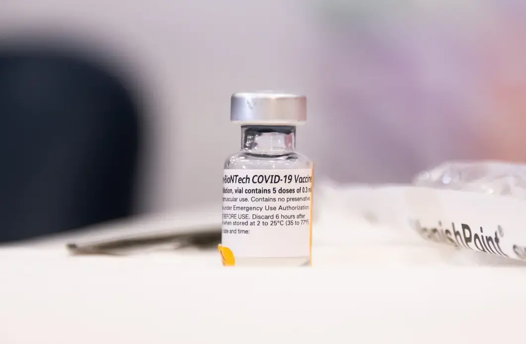 A vial of the Pfizer-BioNTech COVID-19 vaccine. Image by noamgalai / Shutterstock. United States, 2020.