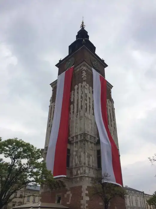 Kraków’s town hall decorated for Flag Day. Image by Ben Mauk. Poland, 2017.