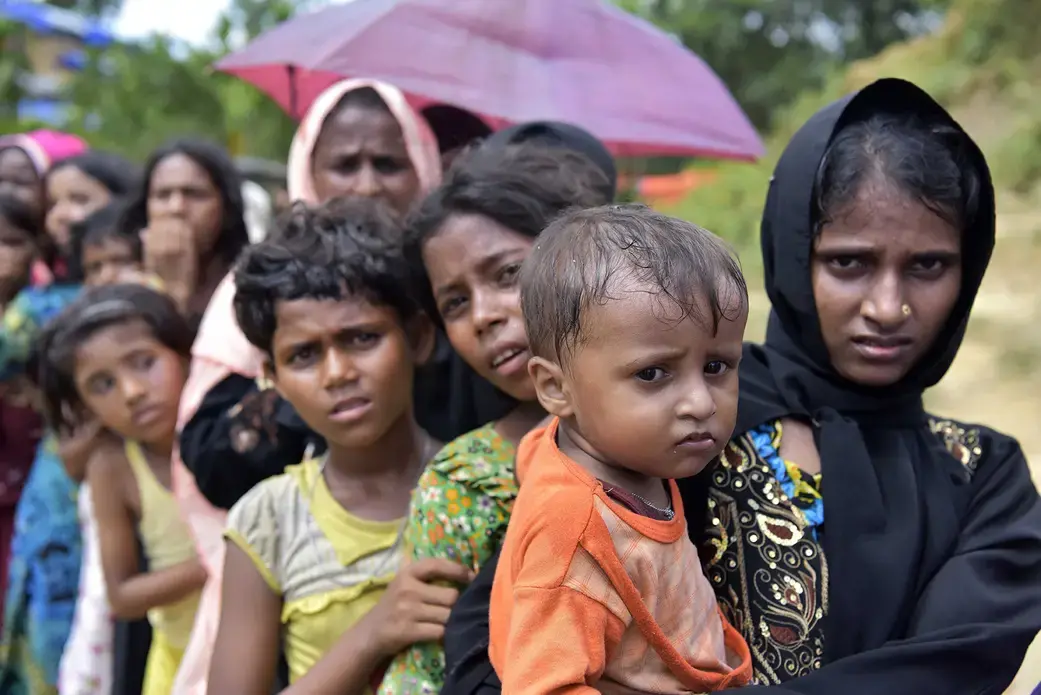 Rohingya wait in a queue in Cox's Bazar. Image by Sk Hasan Ali / Shutterstock.com. Bangladesh, 2017.