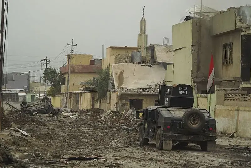 ISOF APC on the street of Mosul. Image by Mstyslav Chernov/Wikimedia Commons. Iraq, 2016.