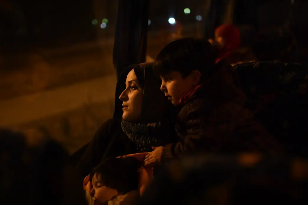 Taimaa, a young Syrian mother of two, takes the overnight bus from Thessaloniki to Athens to find out which European country has decided to accept her claim for asylum. It is a time fraught with uncertainty. Will she get Germany? France? Or a country she has never heard of? Image by Lynsey Addario. Greece, 2017.