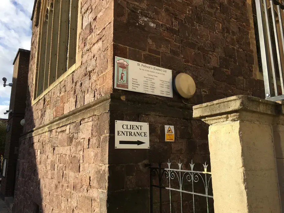 The client entrance to St Petrock's, unobtrusively tucked down the side of a methodist church by the same name. Image by Caitlin Bawn. England, 2016.