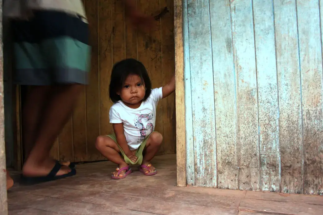 Another one of Karina's nieces, Gabriela, at the entrance to the family's kitchen in Pucallpa.&nbsp;Image by Natalie Hutchison. Peru, 2017.
