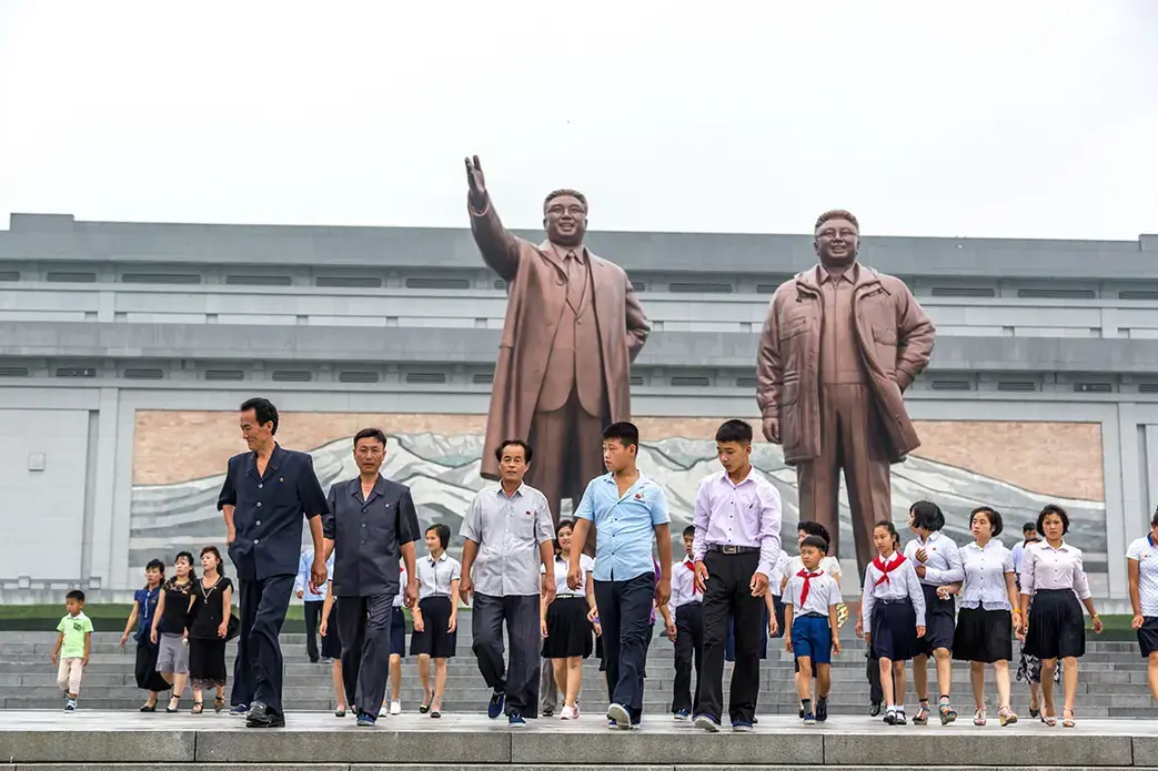 Locals in Pyongyang. Image by LMspencer / Shutterstock.com. North Korea, 2016.