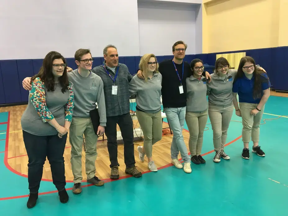 Jon Cohen and Carl Gierstorfer pose with students at Gateway Science Academy in St. Louis.