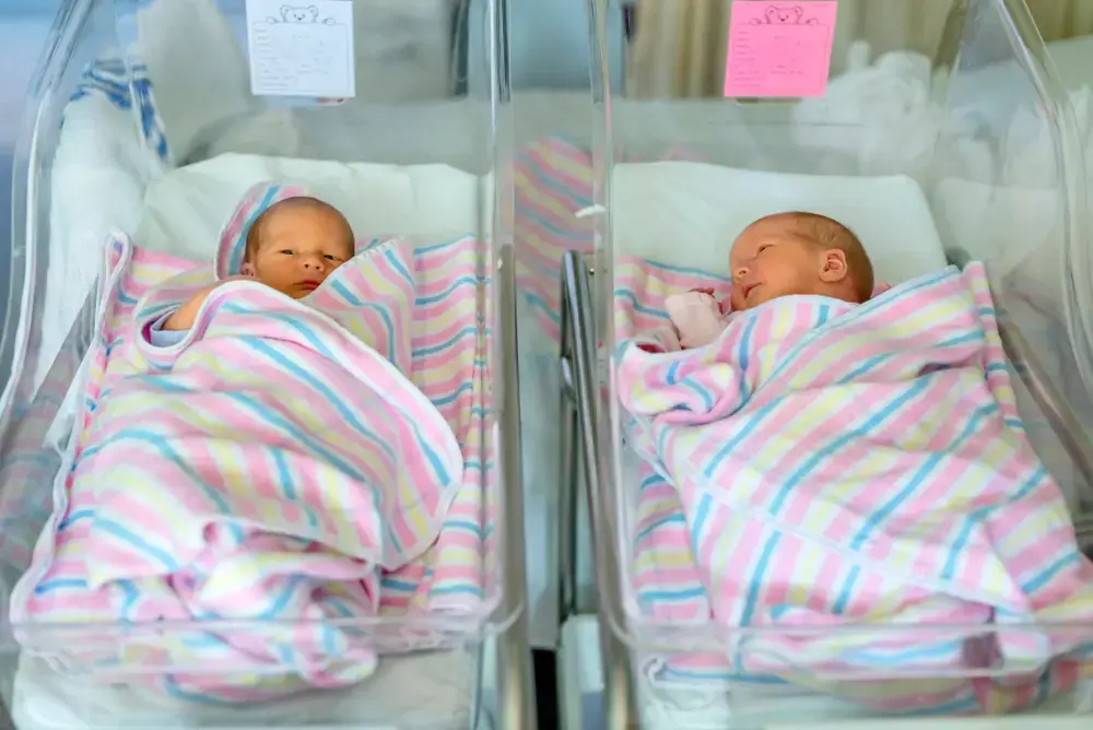 Newborn babies in hospital under blankets. Image by Midkhat Izmaylov / Shutterstock.