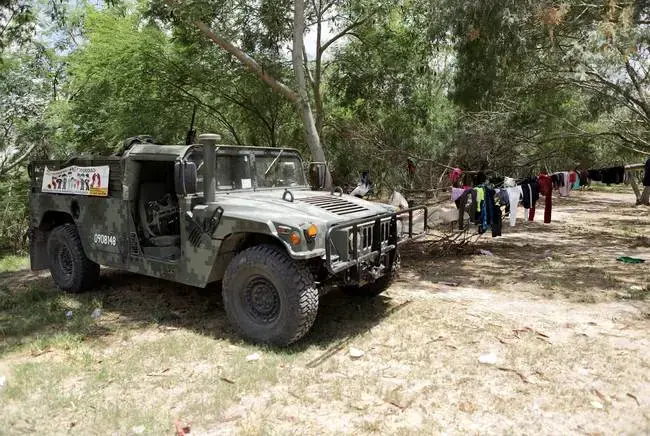 Soldiers with the Mexican military patrol an area near the banks of the Rio Grande in Matamoros, Tamaulipas on Wednesday. Image by Miguel Gutierrez Jr. Mexico, 2019.
