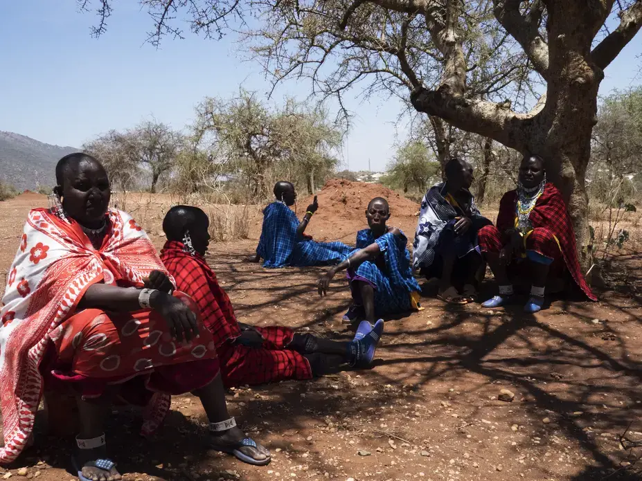  Orendeke village. Maasai women activists meeting and discussing further proceedings. They were tricked by an official out of a deed they had on land, loosing 2/3 of the surface. A NGO built milk center is now in the middle of a developping area and can not be used. They are planning on taking the case to court. Image by Thomas Dworzak. Tanzania, 2018.