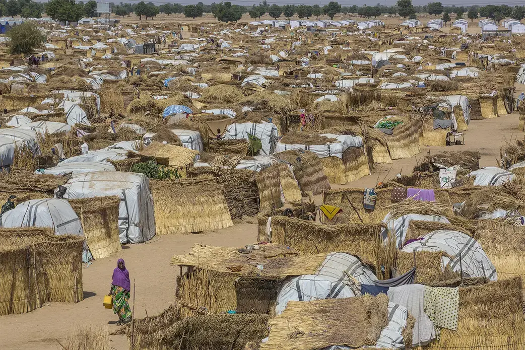 Muna Garage is one of the largest informal camps in Maiduguri, the capital city of Borno state in Nigeria.  Nearly 2 million people who have escaped the violence of Boko Haram are internally displaced; thousands have crowded into this camp, where food, water, and sanitation are scarce. Image by Andrew Esiebo/Associated Press.