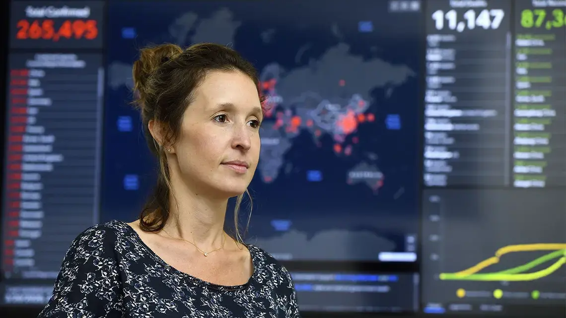 Lauren Gardner of Johns Hopkins University, Baltimore, with her group’s COVID-19 global dashboard. Image by Will Kirk / Johns Hopkins University. United States, undated.