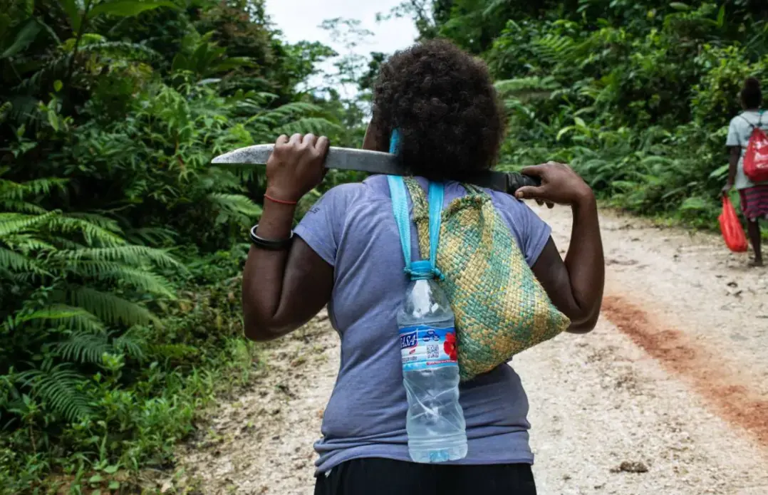 Judy Boifuana hikes in the jungle near Igwa village on the island of Malaita, Solomon Islands, September 18, 2019. Image by Thomson Reuters Foundation/Monique James. Solomon Islands, 2019.