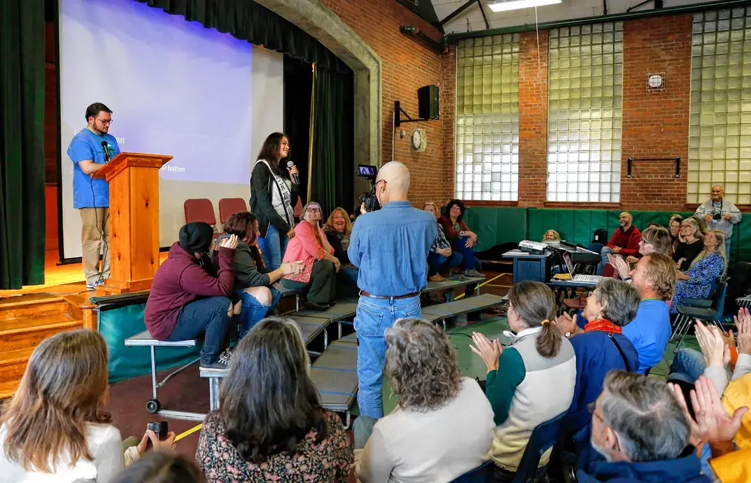 Letcher County, Ky. delegation gives a presentation to Leverett, Mass. audience. Image by Greenfield Recorder. United States, 2017.