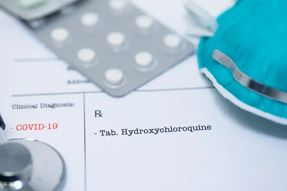 Doctor prescribing hydroxychloroquine for the treatment of novel coronavirus COVID-19. Image by Manjurul Haque / Shutterstock.
