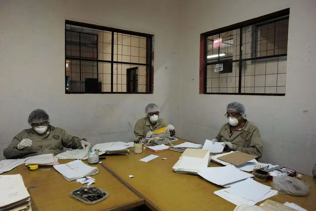 Archivists work in teams, with each team focusing on a particular department of the National Police. The work is tedious at times, but the archivists are motivated by a strong sense of mission. By documenting an agonizing chapter in their country’s history, they hope to ensure that it is never repeated. Image by Lynn Johnson. Guatemala, 2017.