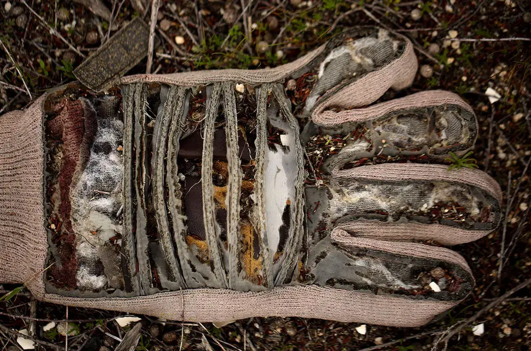 Personal items are left in the desert near the United States-Mexico border wall in Tecate, Mexico. This area is known to be a location for smugglers to bring people into the U.S. Image by Erika Schultz. Mexico, 2019.