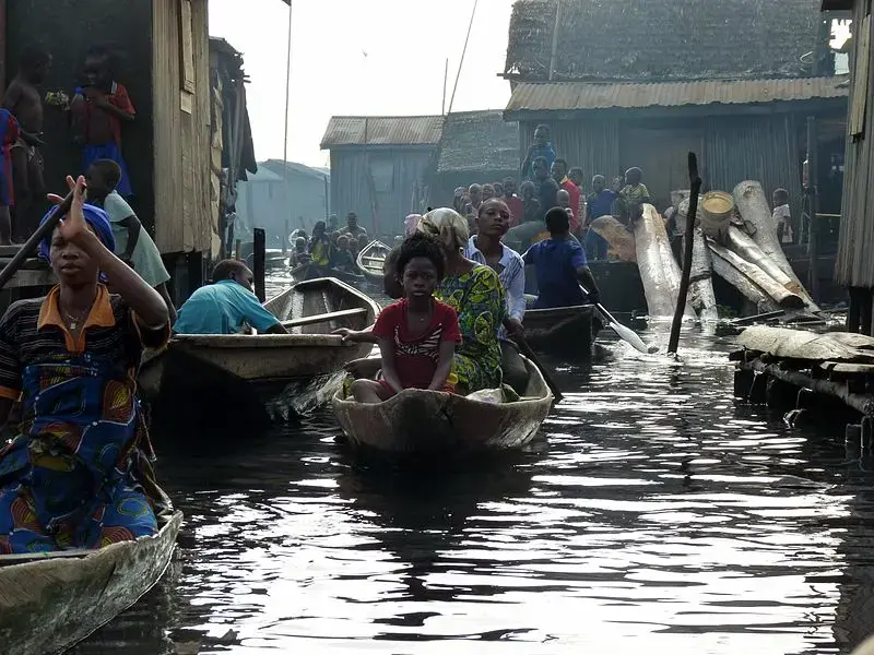 Boats traverse a canal in Makoko, Nigeria. Image by Heinrich-Böll-Stiftung / Wikimedia Commons. Nigeria, 2010.
