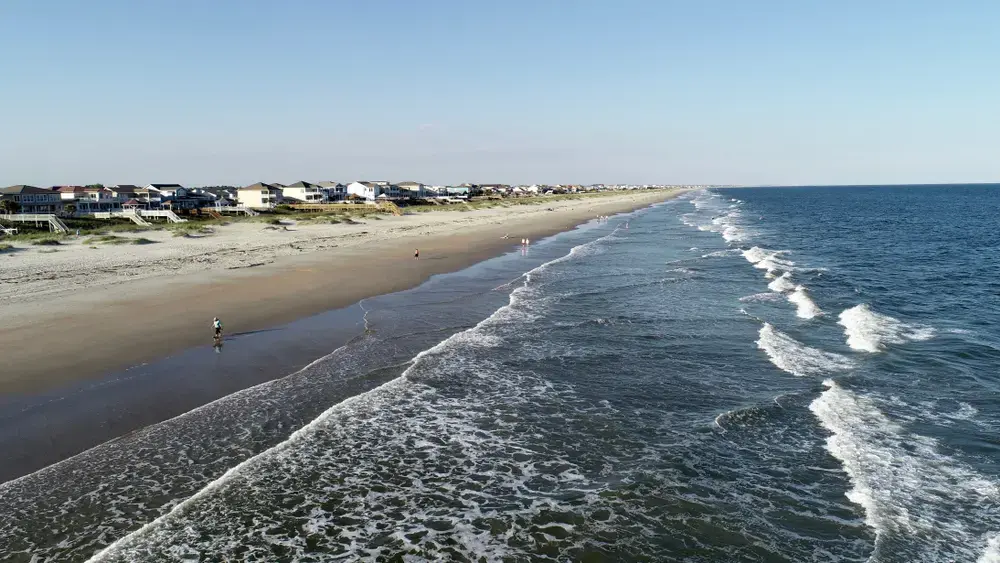 Aggressive waves at Ocean Isle Beach on a spring day. Image by Lewis Directed Films / Shutterstock. United States, undated.