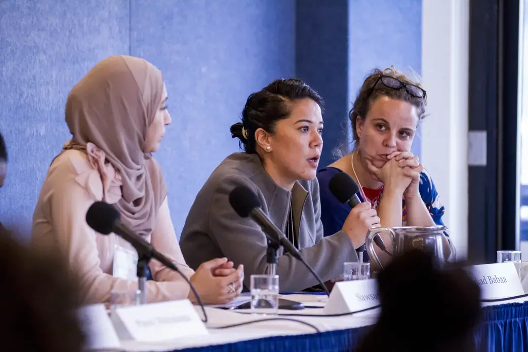 Suhad Babaa, executive director of Just Vision, speaks at a panel on community-level peace building at the "Beyond War" conference. Image by Jin Ding. Washington, D.C., 2018.