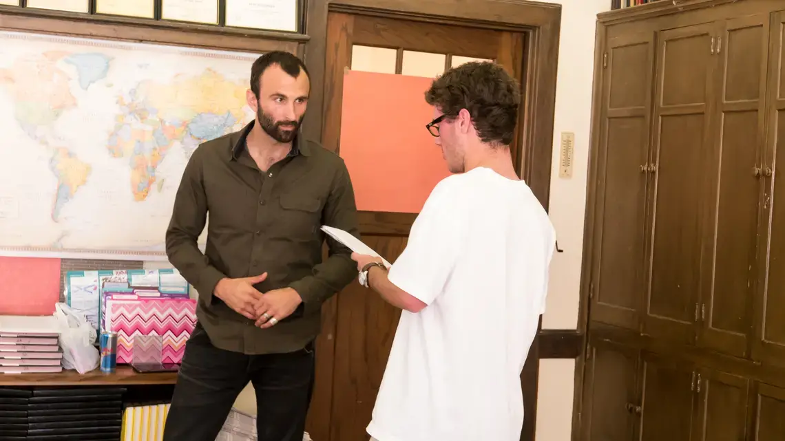 RJ Reynolds High School student Hill Douglas asks Pulitzer Center grantee Jason Motlagh about his reporting on the textiles industry in Bangladesh as part of Weaving Connections, a documentary filmmaking program developed as part of Pulitzer Center's NewsArts initiative. Image by Fareed Mostoufi. United States, 2017.