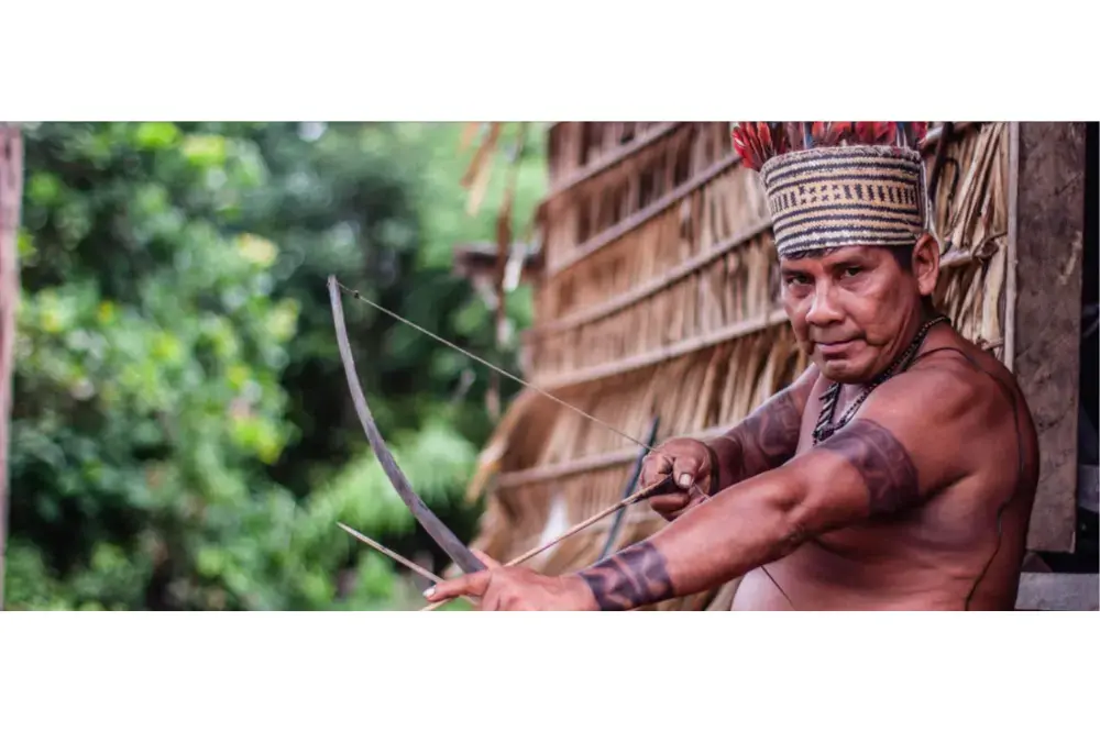 Bernardino, the Campo Branco village tuxaua (leader). He has so far resisted threats from outsiders who have demanded he leave the Sateré’s ancestral lands on the Mariaquã River. Image by Matheus Manfredini. Brazil, 2019.