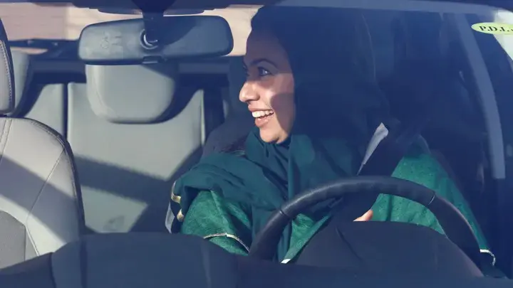 A Saudi woman sits in a car during driver's training at a university in Jeddah. Image by Faisal Al Nasser. Saudi Arabia, 2018.