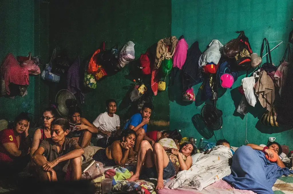 This precinct holds 58 women who wait for their trial. The only light they have comes from a single bulb. Image by Ana María Arévalo. Venezuela, 2018.