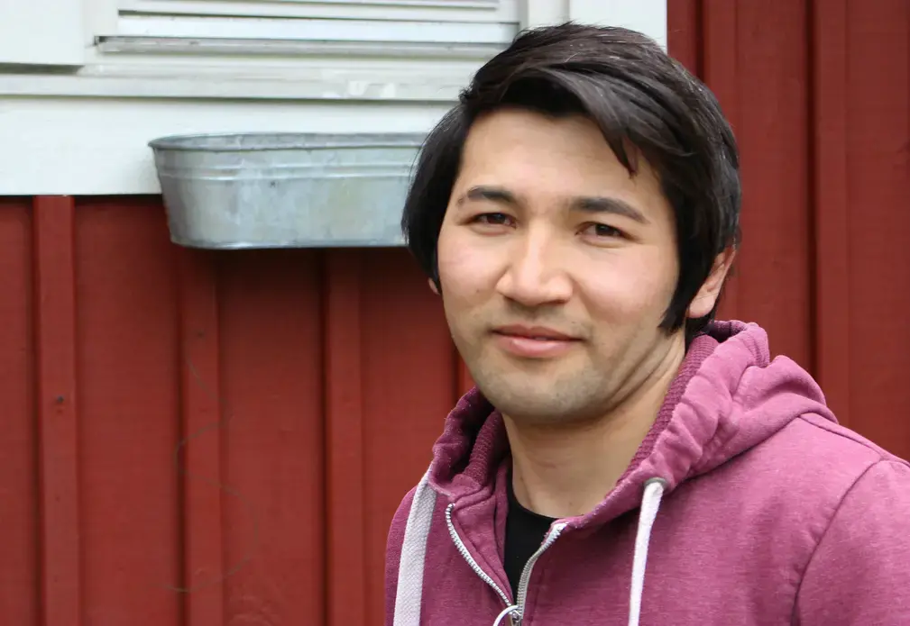 Abdullah, 18, shown here in front of an asylum center in Kungälv. Image by Amy Russo. Sweden, 2017.
