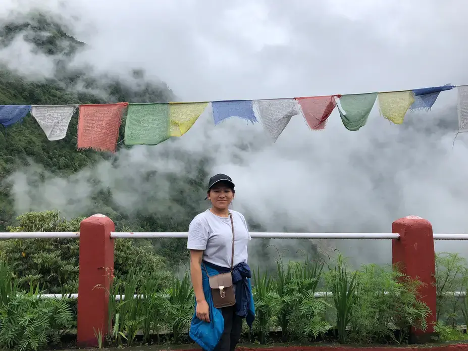 Certified trekking guide Jashudha Rai leads a group of hikers to Poon Hill in the Annapurna region of Nepal. Image by Heather Lawson. Nepal, 2018.