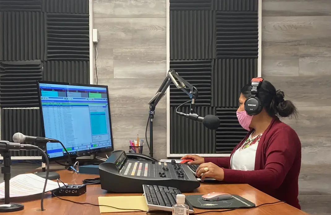 Lidia López prepares her program for Radio Indígena in&nbsp;Oxnard. Image by Julia Knoerr. United States, 2020.