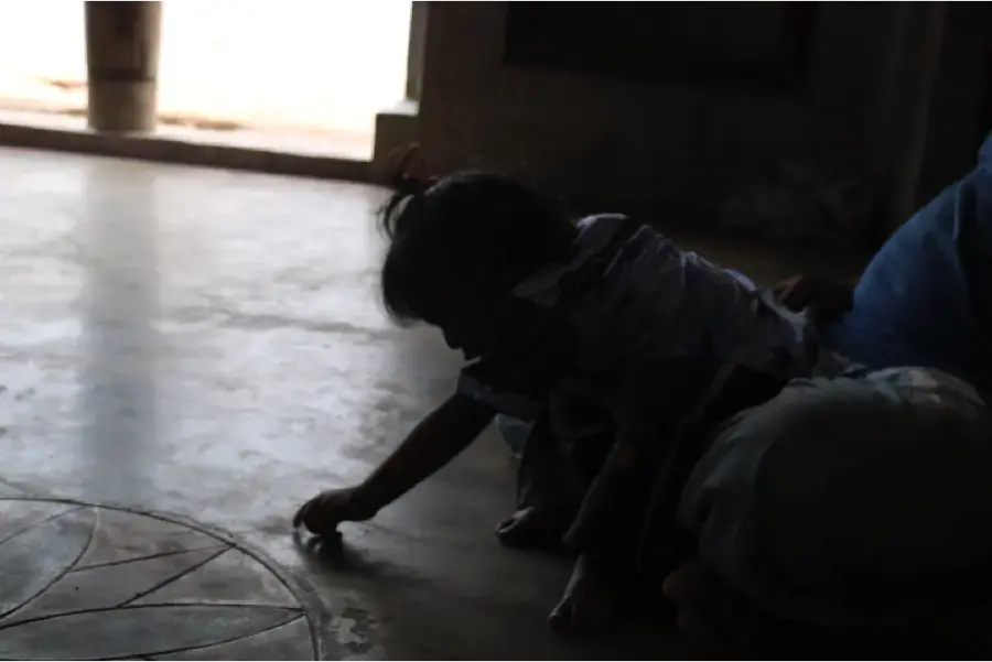 Kathir has trouble sitting properly and learning to walk because he was born with a club foot.&nbsp;Image by Praveena Somasundaram. India, 2017.