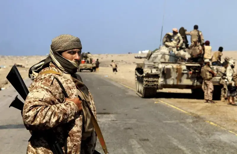 Coalition-backed fighters advance on Yemen’s Red Sea port town of Mocha in this Jan. 11 2017, photo. The coalition forces eventually captured the town from Shiite rebels known as Houthis. Some fighters in the unit were openly al-Qaida, wearing Afghan-style garb and carrying weapons with an al-Qaida logo, a sign of how closely the militants have been involved in the war against the Houthis, who are seen by Saudi Arabia and the United Arab Emirates as a proxy for Iranian influence. Image by AP. Yemen, 2017.