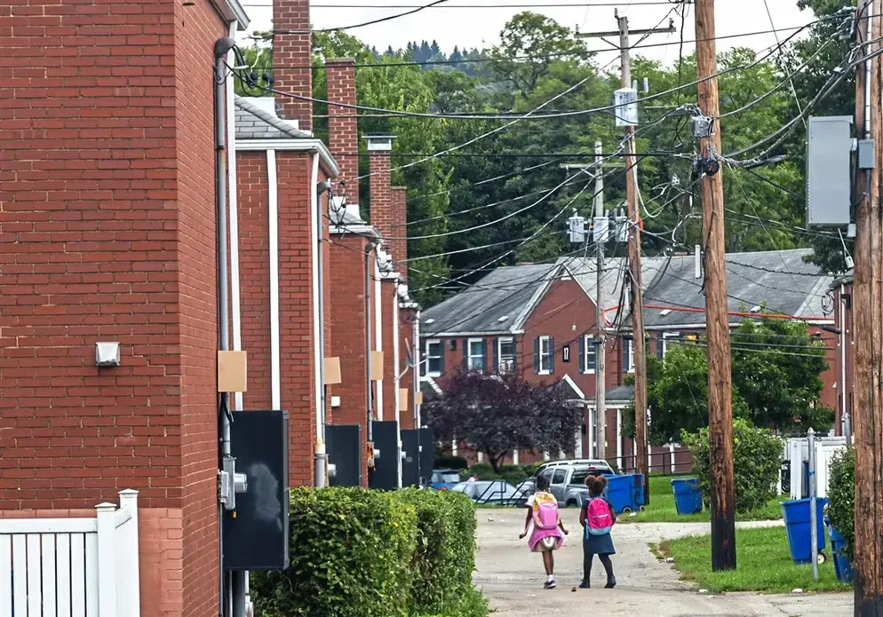 Children walking through the neighborhood.