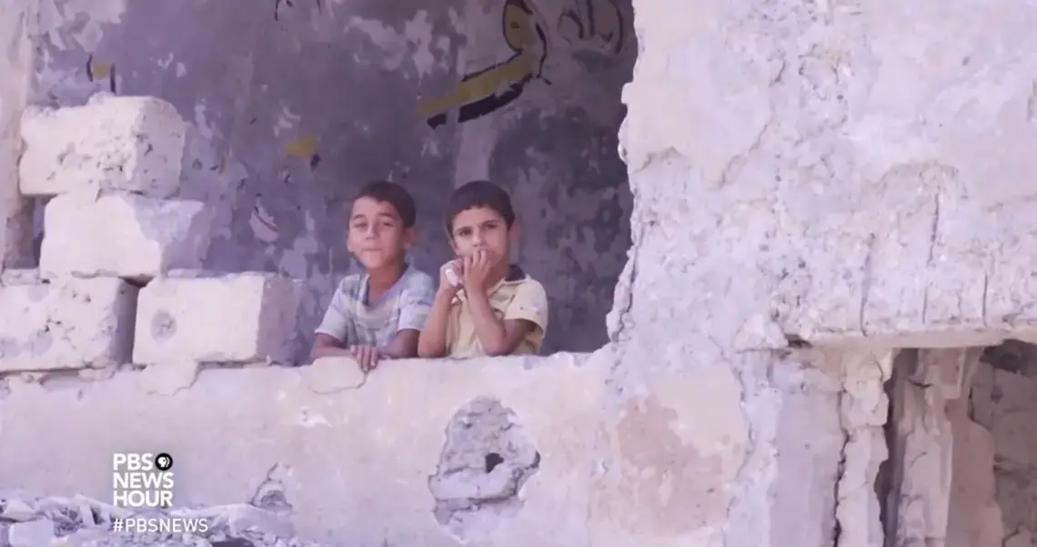 Still image taken from PBS NewsHour video, Syrians try to salvage life from the wreckage of Raqqa. Aired August 16, 2017.
