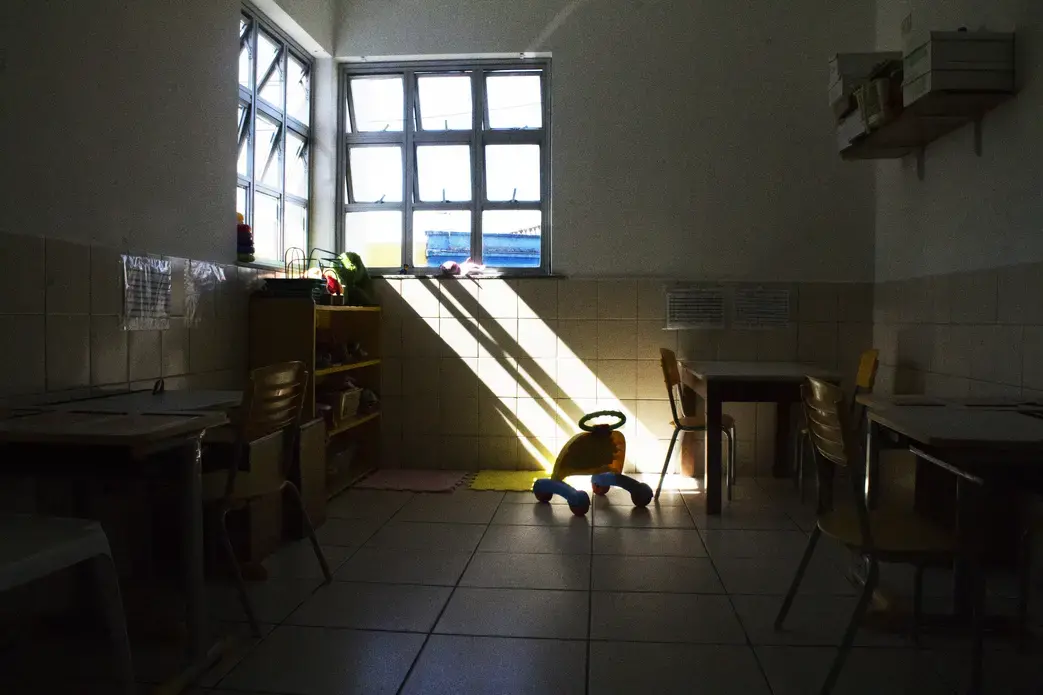 In a vacant children's room, toys and tools are stored in their assigned places. Image by Amanda Michelle Gordon. Brazil, 2018.