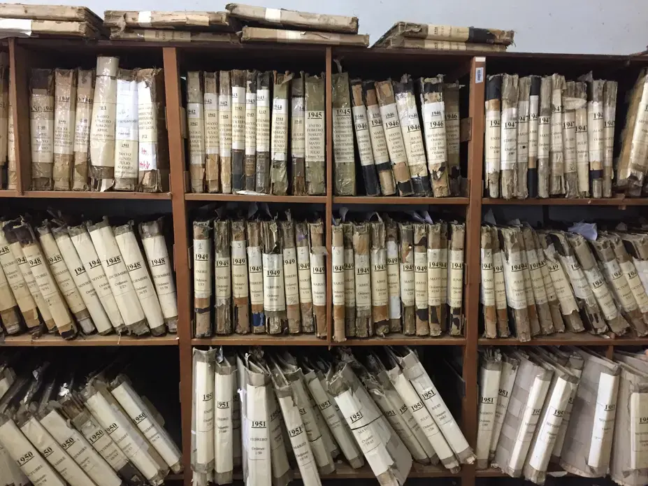 Investigators search archives all around the world looking for the names of potential perpetrators, including the crumbling ship manifests at Argentina's Hotel de Inmigrantes. Image by Linda Kinstler. Argentina, 2017.