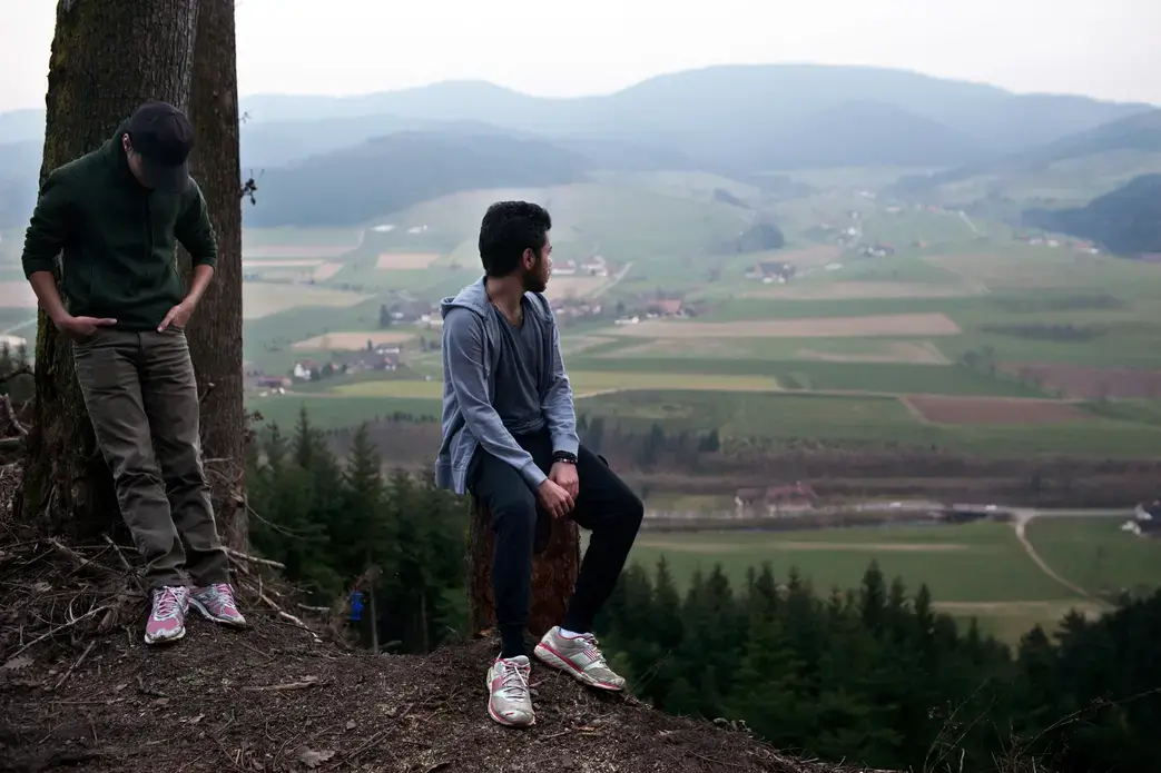Rafat and Naif on the overlook in the Black Forest near Zell am Hammersbach, Germany. Image by Holly Pickett. Germany, 2014.