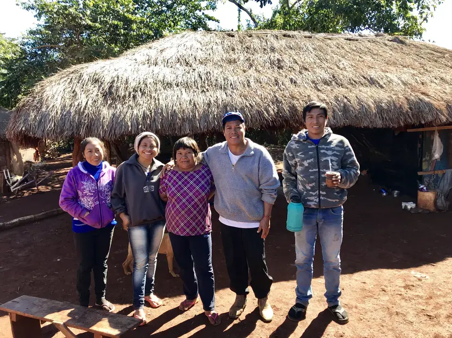 Cacique (chief) Ezequiel João Kaiowá (middle wearing a hat) and his family have waited since 2006 on the creation of an official Indigenous territory that will respects the historical boundaries of their village. Image by Rafael Lima. Brazil, 2019. 