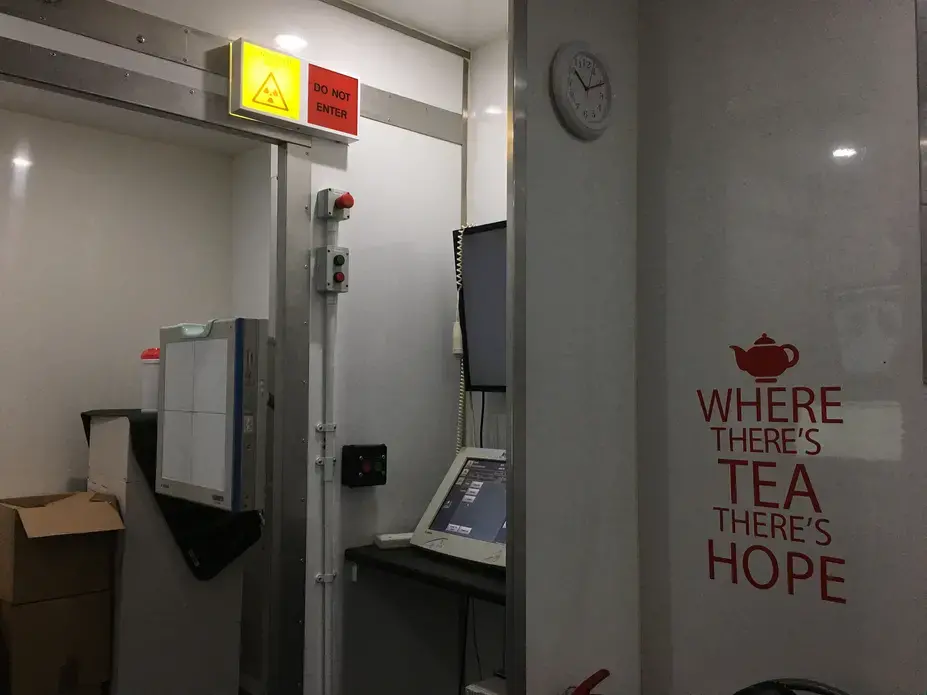 Inside the Find and Treat TB van, with the machine that x-rays patients and the computer that allows radiographers to instantly analyze scans. Image by Caitlin Bawn. England, 2017.