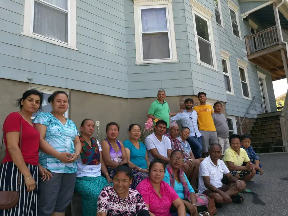 A group of Bhutanese refugees residing in the greater Worcester area with Purna Neupane (fourth from right), Harvard Medical School researcher Dr. Nadeem Kasmani (third from right), and Washington University in St. Louis student Ani Gururaj (second from right). Image courtesy of Ani Gururaj. Massachusetts, 2018.